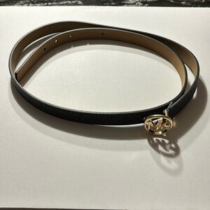 Genuine Michael Kors Belt, Black with Golden buckle. Waist size 38-42 inches.